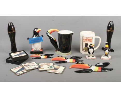 A collection of Guinness advertising items, to include wall plaques, lamp base and place mats. Most ceramic items bearing Car
