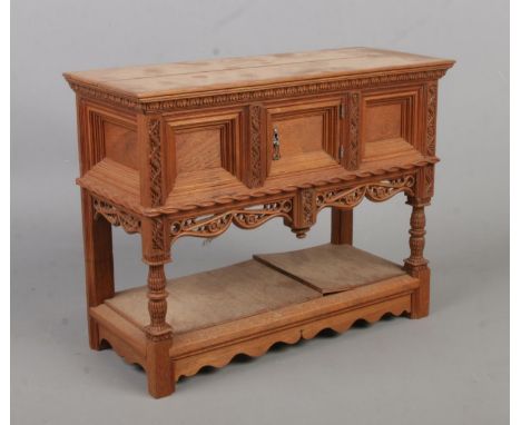 A walnut miniature model of a buffet sideboard. Based on an example from Ockwells Manor, Berkshire. Height 20.5cm.  