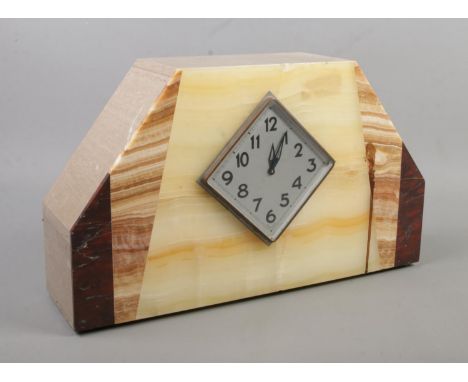 An Art Deco marble mantel clock. Having diamond shaped silvered dial and Arabic numeral markers. Housing French movement. Hei