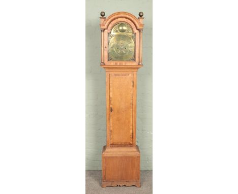 A Nineteenth Century oak longcase clock, with brass dial labelled for James Todd, Bradford. Featuring Roman Numeral dial and 