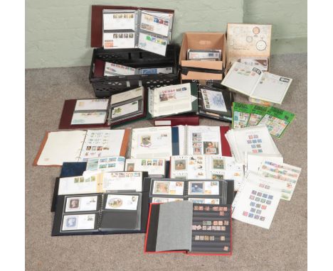 A large quantity of British stamps, presentation packs and first day covers. Mostly in albums. Includes various subjects, etc