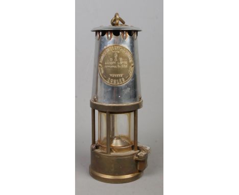 An Eccles 'Type 6' M&amp;Q Miner's Safety Lamp; by The Protector Lamp and Lighting Co. Ltd.  Oxidation to the back.