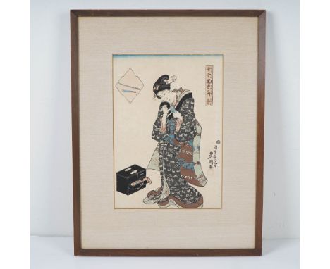 Japanese woodblock print by Utagawa Toyokuni depicting a bijin (beautiful woman) adjusting a small blade in her hand. She sta