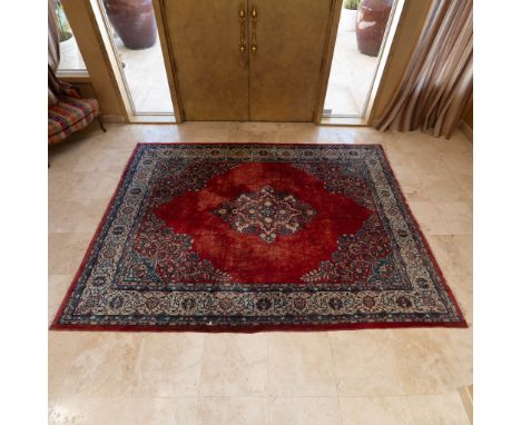 A Persian rug by Avakian Bros. Inc., made in Iran, featuring 100% virgin wool pile. The rug showcases a central medallion sur