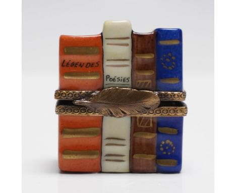 Charming hand-painted Limoges porcelain treasure box designed as a stack of colorful books titled “Legendes” and “Poesies,” s