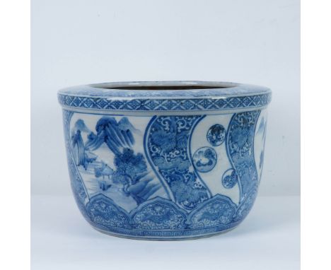 Large hand-painted Chinese blue and white fish bowl planter featuring intricate scenic panels with landscapes, mountains, and
