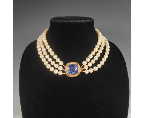 Elegant Swarovski vintage-style three strand choker necklace featuring cream faux pearls accented with a central cushion-cut 