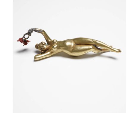 Exquisite Austrian Vienna Bronze sculpture depicting a reclining nude female figure holding a bouquet of enameled red flowers