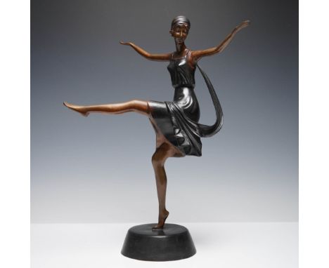 A striking Art Deco-style bronze sculpture of a female dancer poised mid-kick, balancing gracefully on one foot with outstret