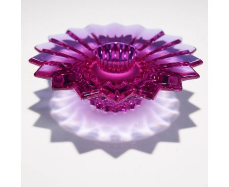 A stunning Baccarat amethyst crystal candle holder, crafted in a striking starburst design. This elegant piece features preci