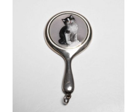 Delightful miniature hand mirror featuring a painted enamel portrait of a black and white cat on a neutral background. The mi