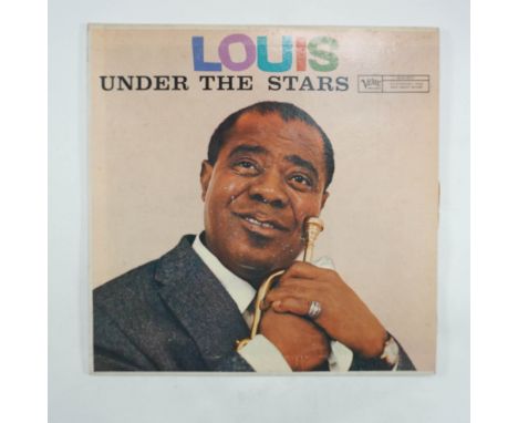 A vintage pressing of Louis Under The Stars, the classic jazz album by Louis Armstrong, released by Verve Records. This LP fe