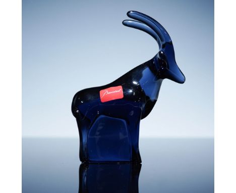 Elegant Baccarat crystal figurine from the Noah's Ark collection, depicting an ibex in striking midnight blue crystal. Design