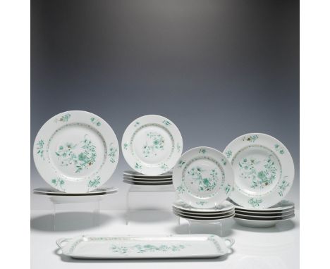 A fine French porcelain dinnerware set by L. Bernardaud &amp; Co. Limoges in the Pekin pattern. The set features a delicate g
