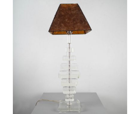 Gorgeous Modernist table lamp featuring a tall, geometric body composed of stacked Lucite blocks in varying sizes, supported 