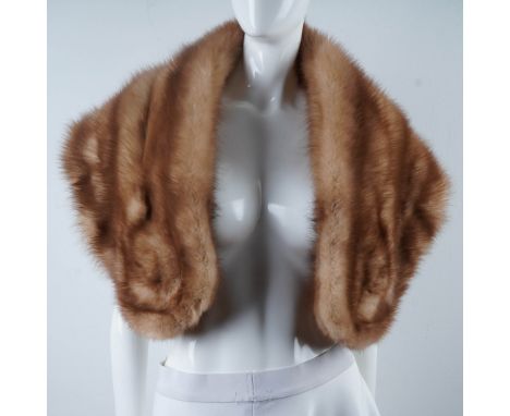 A luxurious vintage shawl fur, featuring a rich light auburn hue with subtle striping and a soft, glossy texture. This elegan