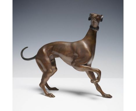 A dynamic bronze sculpture of a greyhound or whippet in a poised walking stance, rendered with exceptional anatomical detail 