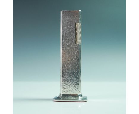 The lighter features a hammered-dimple texture on its elongated rectangular body, designed for stability and ease of use. The