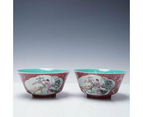 Pair of Chinese porcelain bowls featuring intricate famille rose decoration with finely detailed figural scenes set within me