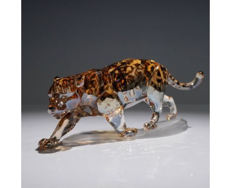 Stunning Swarovski crystal figurine of a jaguar in a dynamic stalking pose, crafted in Crystal Golden Shine with accents in C
