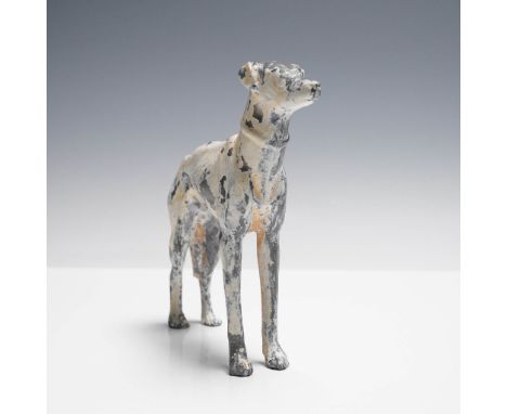 Art deco cast metal greyhound figurine with remnants of its original hand-painted finish. The figure captures the distinctive