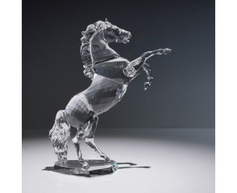 A dynamic showcase of motion and elegance, this crystal rearing horse figurine captures the spirit and strength of the noble 