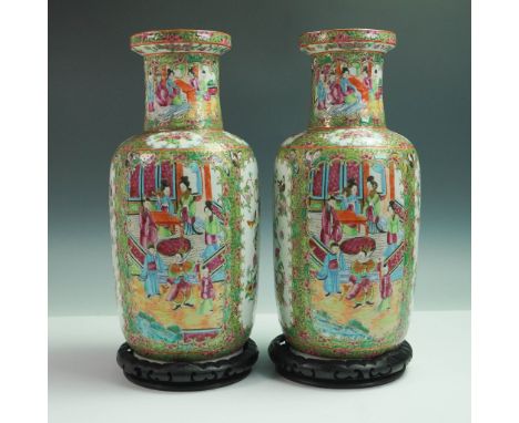 A finely painted pair of Chinese Rose Medallion porcelain vases, each depicting elaborate court scenes and garden motifs with