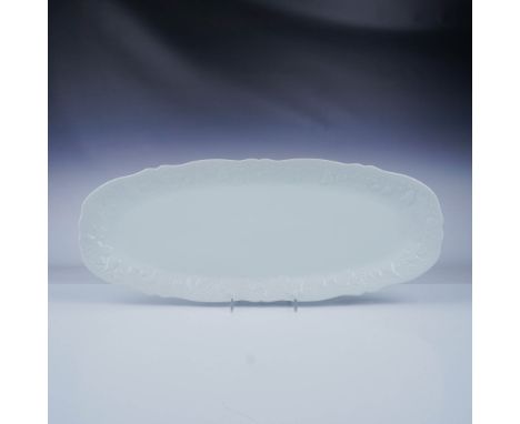 This elegant porcelain fish platter is crafted in the California Blanc De Blanc pattern. The design features a pristine all-w