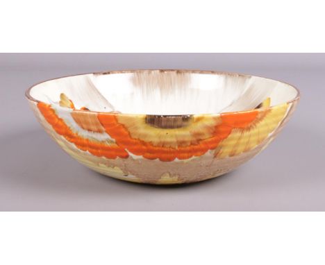 A Clarice Cliff ribbed bowl in the 'Rhodanthe' design. Marked Wilkinson LTD to base. (20cm diameter)  Damaged to centre of bo
