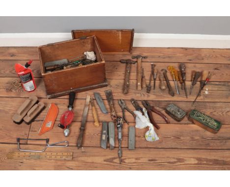 A wooden tool box with various vintage tools.  Plyers, hammers, various screwdrivers, Stanley knives, wooden folding ruler an