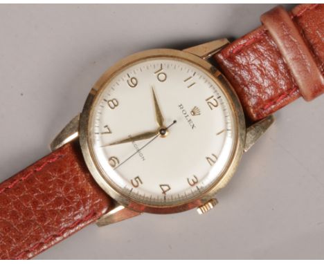 A vintage gents 9ct gold Rolex Precision manual wristwatch with satin dial, Arabic numeral markers and centre seconds. The ca