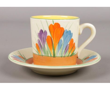 A Wilkinson Ltd Clarice Cliff coffee cup and saucer decorated in the Autumn Crocus design.  Good condition.