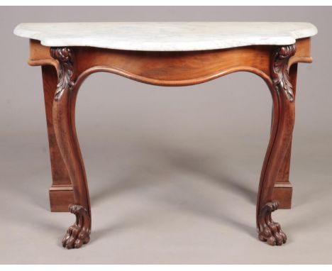 A Victorian mahogany console table with marble top and carved lion paw feet. 122cm wide x 82cm high x 52cm deep.  