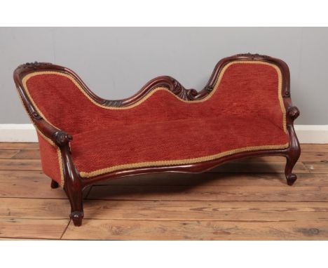 A child's carved mahogany sofa. Height 47cm, Width 113cm, Depth 45cm.  