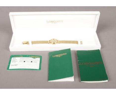 A boxed ladies Longines wristwatch, with stainless steel back and strap. Contains original certificate and origin, along with
