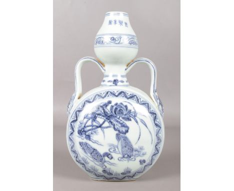 A 19th century Chinese blue and white moon flask, bearing four character Yongle mark. Painted in underglaze blue and decorate