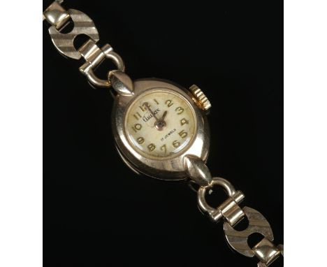 A ladies 9ct gold Gudax manual wristwatch on 9ct gold bracelet strap. 12g.  