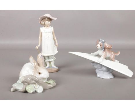 Three Lladro/Nao figures. 'Let's Fly away' No. 6665, 'Rabbit eating' No. 4772, to include Nao girl with parasol.  