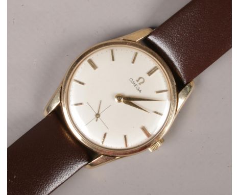A gents 9ct gold Omega manual wristwatch on leather strap. Satin dial, baton markers and subsidiary seconds.  Running.