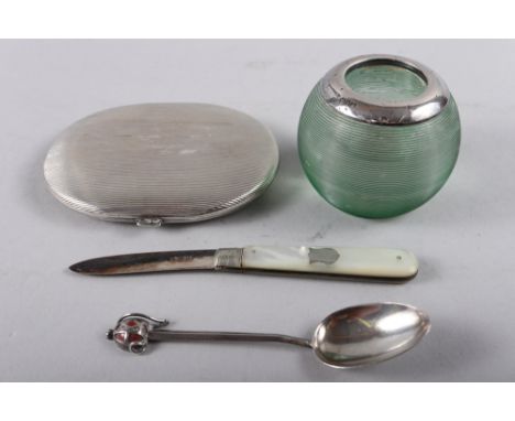 A Continental 800 grade cigarette case, a silver mounted vesta striker, a coffee spoon handle, formed as a claymore and a sil