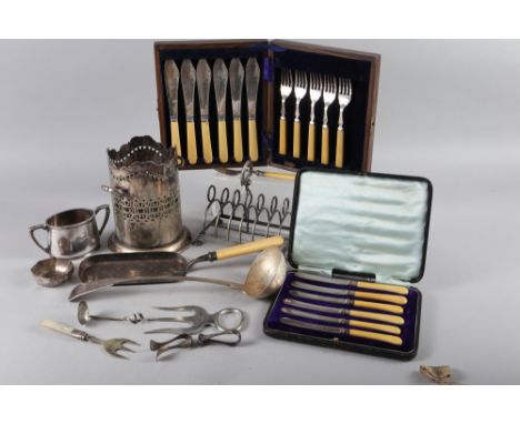 A silver plated siphon stand, a plated toast rack, a crumb scoop, a soup ladle and other plate 