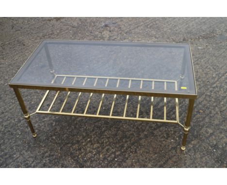 A brass frame and smoked glass low coffee table, 36" long x 18" deep x 60" high, and a pair of matching lamp tables, 18" squa