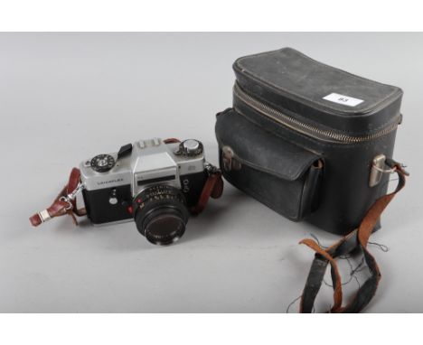 A Leicaflex SL Leitz Wetzlar camera, Serial Number 1295519 and Summircron R 1:2/50 lens, in travelling case 