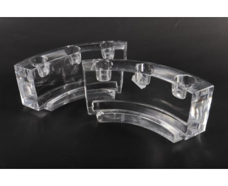 A pair of Baccarat cast and carved glass quadrant three-light candlesticks, 7" wide (chips) 