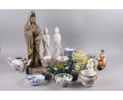 A Chinese yellow polychrome decorated teapot and four matching teacups, a planter with insect and floral decoration, five fig