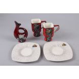 A pair of vintage abstract decorated coffee cans and saucers, and a similar vase, 4 1/2" high