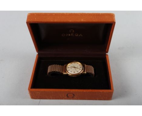 A gentleman's Omega Seamaster automatic 18ct gold bracelet watch with silvered dial and Arabic and baton numerals, 33mm case 