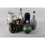 A studio pottery jug with floral decoration, 12" high, a cylinder vase, 12" high, two studio pottery