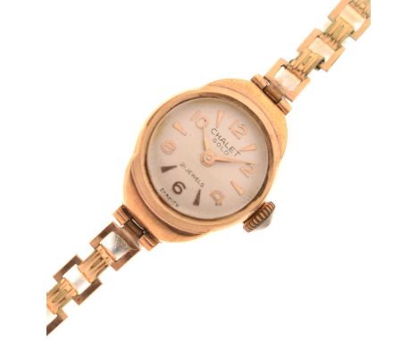 Chalet - Lady's 9ct gold cased bracelet watch, the silvered dial with applied gilt triangular and Arabic hour markers, signed
