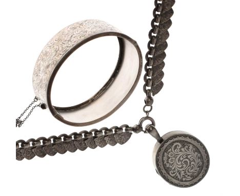 Victorian style engraved silver oval locket, 45mm excluding loop, with fancy necklace of overlapping engraved spade-shaped li